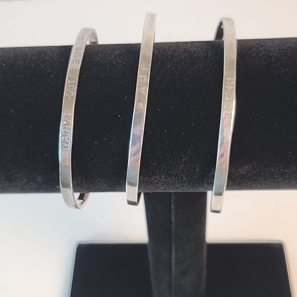 Three silverplated open bracelets - "Joy"- "Live, Love, Laugh" - "Peace"